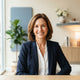 A diverse, authentic portrait of a smiling woman in a professional, bright setting representing a satisfied customer.